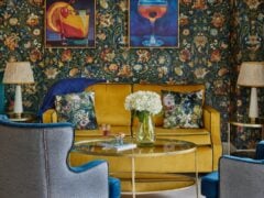 Stylish living room with floral wallpaper