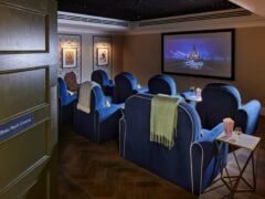 Beau Nash Cinema with blue chairs and Disney movie.
