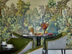 Elegant cafe with vibrant mural and pastries.