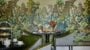 Elegant cafe with vibrant mural and pastries.