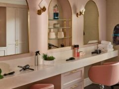 Modern salon with styling tools and mirrors.