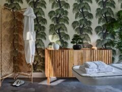 Luxurious spa room with tropical decor.