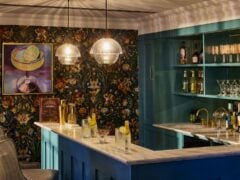 Elegant home bar with floral wallpaper in our care home in Bath.