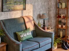 Cosy living room with blue armchair and plants