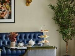 Cosy afternoon tea setup with snacks and drinks.