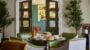 Cosy tearoom with scones and teacups on the table.